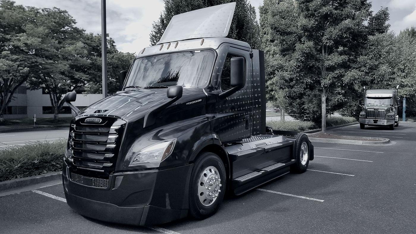 A day cab tractor parked at a yard, bobtail and ready to be matched to a trailer.